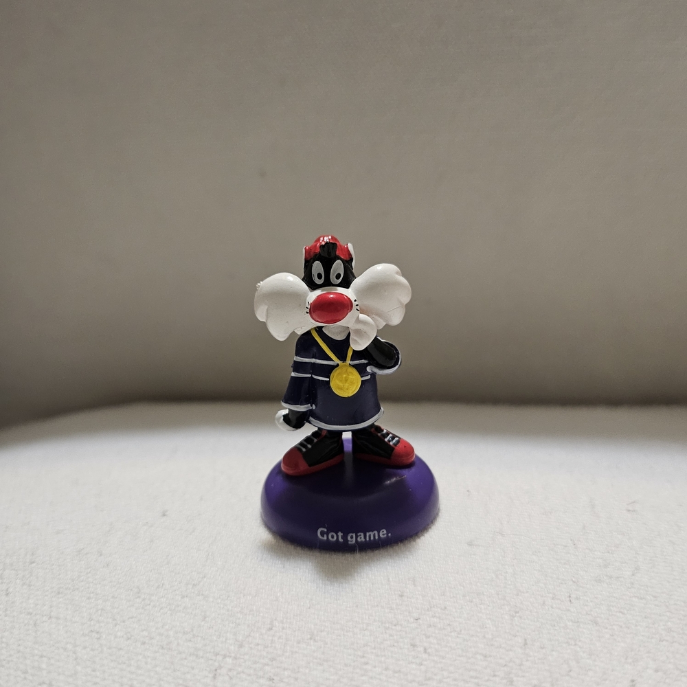 Cartoon Character Figurine with Purple Base